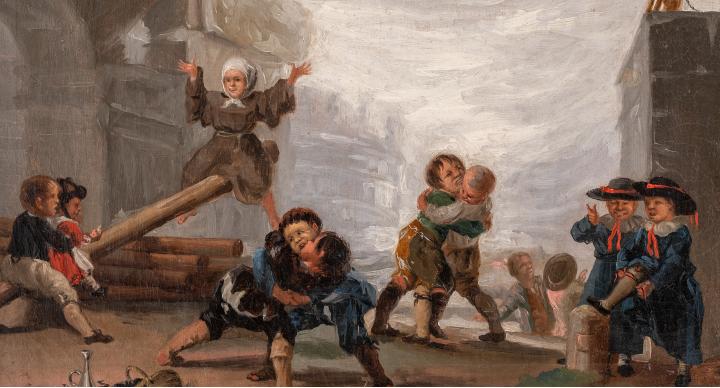 Niños jugando al balancín